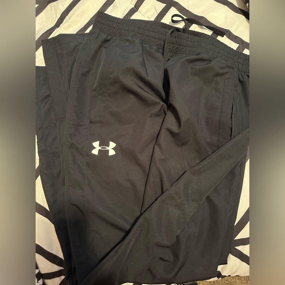 Under Armour track pants.